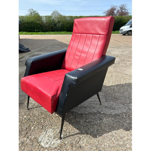 261 - A retro red and black vinyl armchair