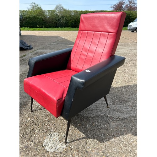 261 - A retro red and black vinyl armchair