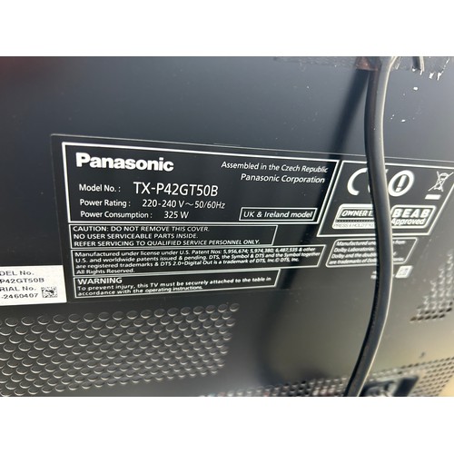 277 - A 42inch Panasonic tv with lead, remote and manual on modern black glass stand