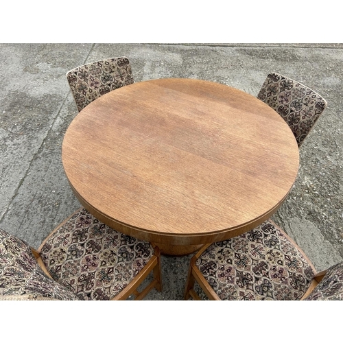 143 - A deco style light oak circular dining table with four chairs 107cm diameter  x 75 high