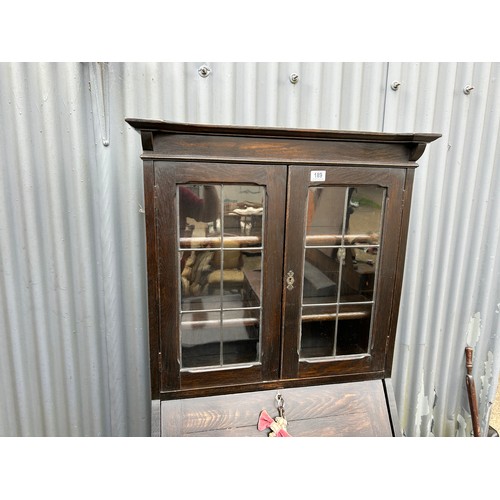 189 - An oak students bureau with leaded glass top