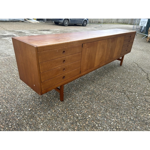 1 - A mid century danish long teak sideboard 244 x  45 x 76