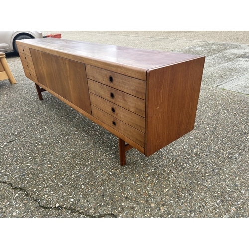 1 - A mid century danish long teak sideboard 244 x  45 x 76