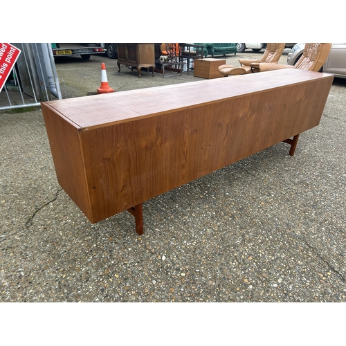 1 - A mid century danish long teak sideboard 244 x  45 x 76