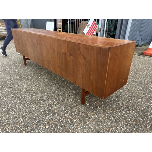 1 - A mid century danish long teak sideboard 244 x  45 x 76