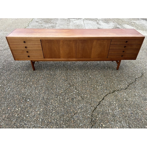 1 - A mid century danish long teak sideboard 244 x  45 x 76