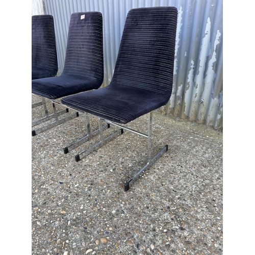 100 - A set of three pieff mid century dining chairs, black upholstered  on chrome supports