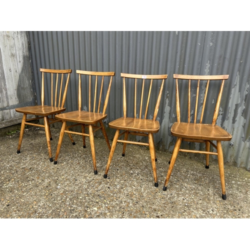 106 - Set of four ercol stick back kitchen chairs