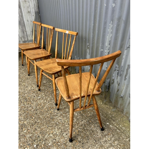 106 - Set of four ercol stick back kitchen chairs