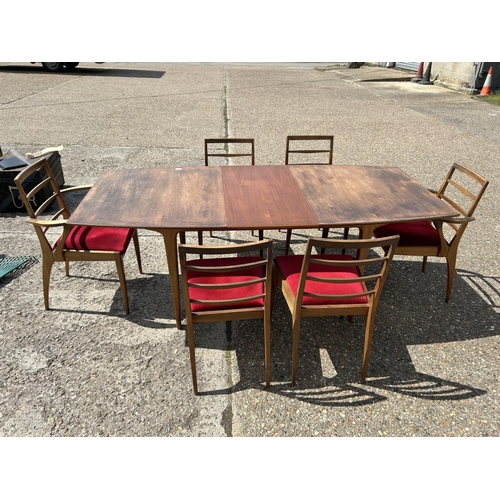 113 - A mid century extending teak extending  dining table and six chairs by MCINTOSH