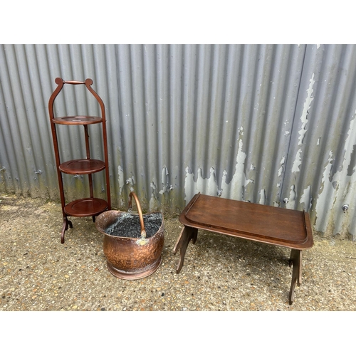 126 - A folding cake stand, copper bucket and a folding lap tray