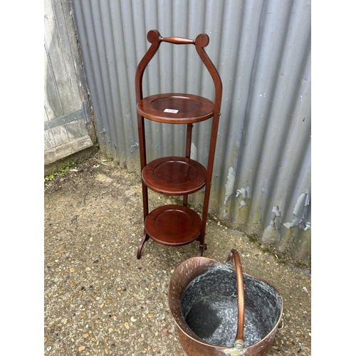 126 - A folding cake stand, copper bucket and a folding lap tray