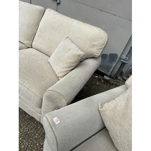 130 - A modern beige upholstered three piece lounge suite consisting of two seater sofa and two chairs