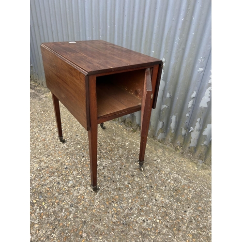 136 - A Victorian mahogany drop leaf work table with drawer to one end and cupboard the other  56 x40x 74