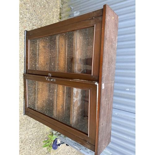 141 - A glazed two door bookcase 110x24x110