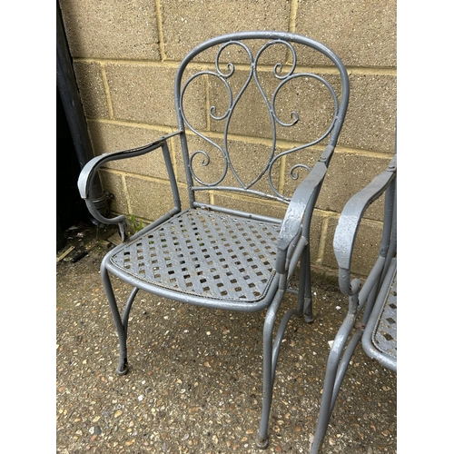 145 - A pair of grey painted metalwork garden chairs