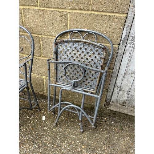 145 - A pair of grey painted metalwork garden chairs