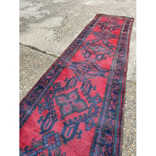 149 - A pair of red and blue oriental runner rugs 360x 95