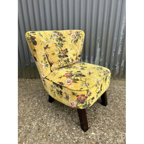 154 - An OASIS floral pattern bedroom chair