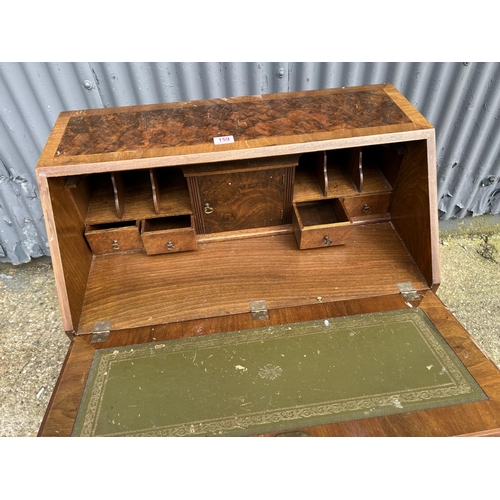 159 - A reproduction walnut bureau