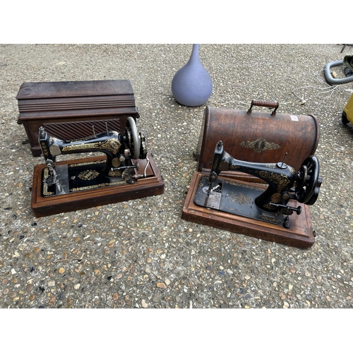 169 - Two cased singer sewing machines