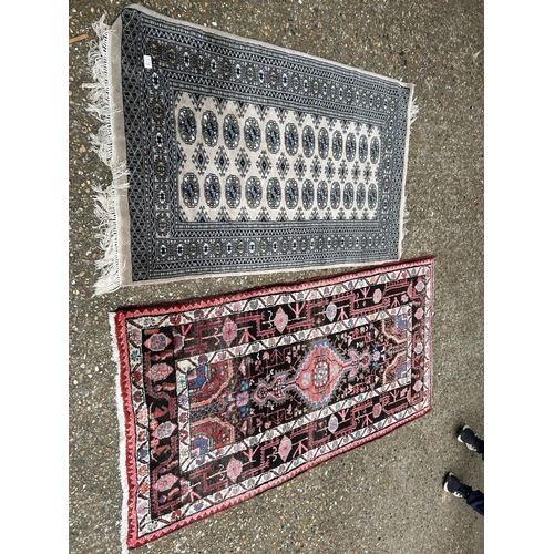 Two oriental pattern rugs