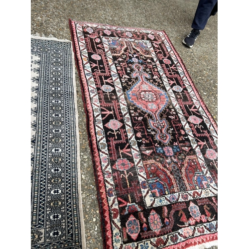 176 - Two oriental  pattern rugs