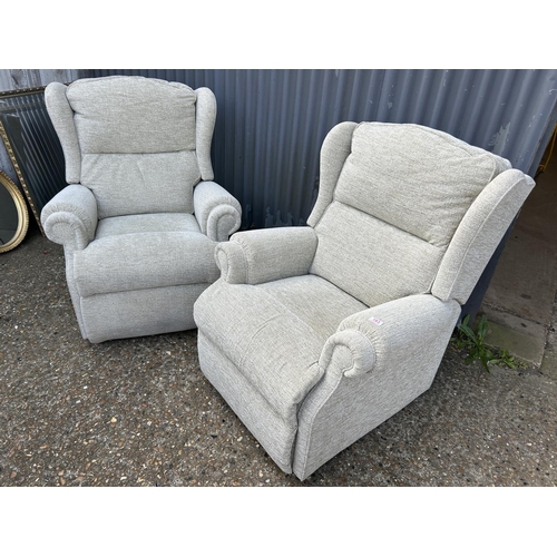 183 - A clean pair of beige upholstered armchairs (one recliner)