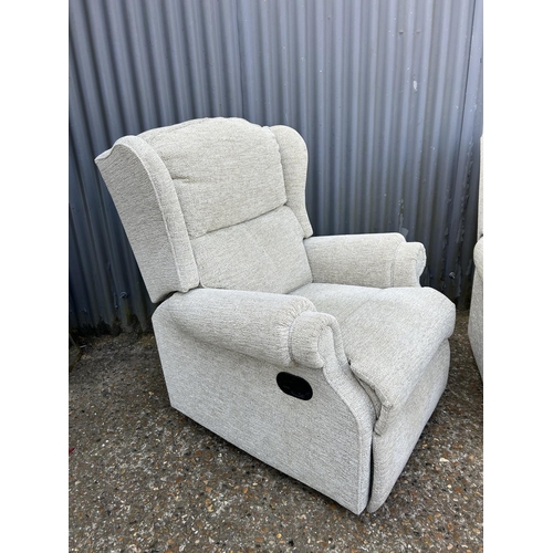 183 - A clean pair of beige upholstered armchairs (one recliner)