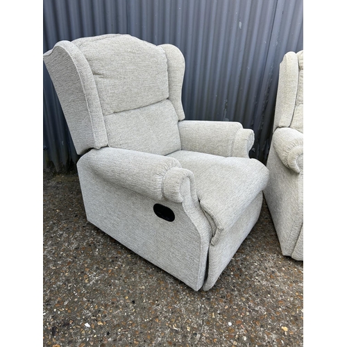 183 - A clean pair of beige upholstered armchairs (one recliner)