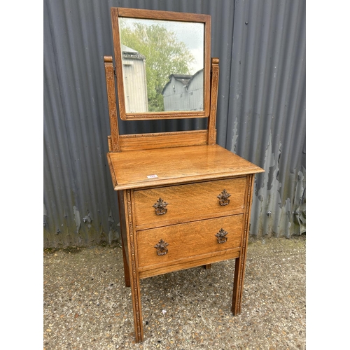 199 - A small oak two drawer dressing chest