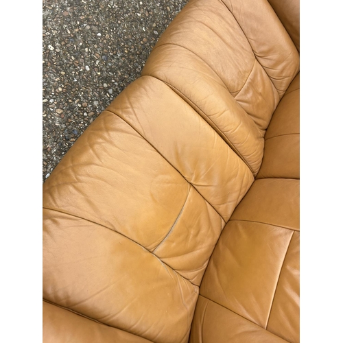 2 - A  tan brown leather EKORNES STRESSLESS two seater sofa together with matching reclining armchair