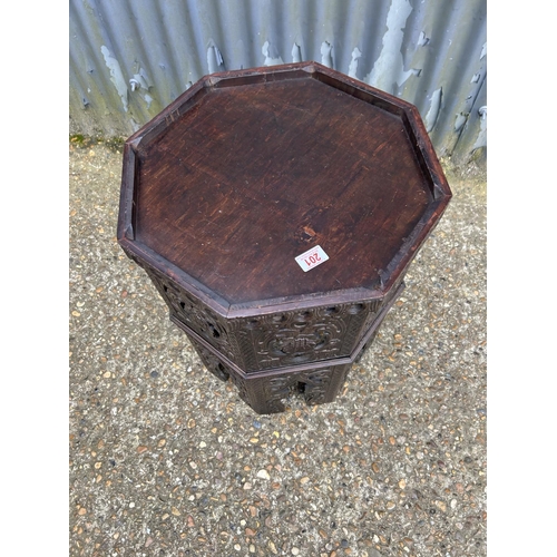 201 - A carved octagonal table 40 diameter 65 cm high