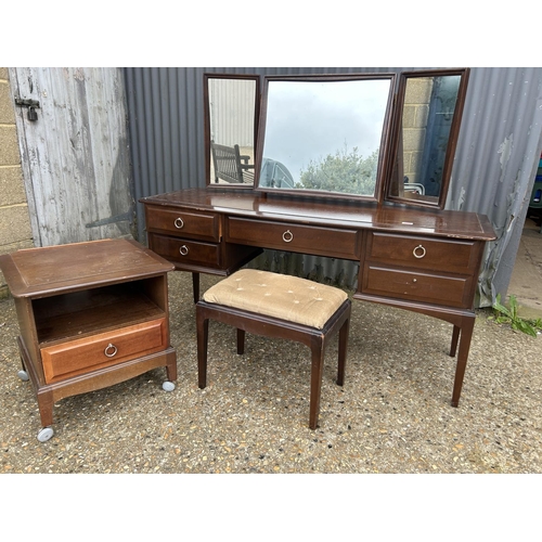 205 - A stag minstrel dressing table with stool and matching bedside