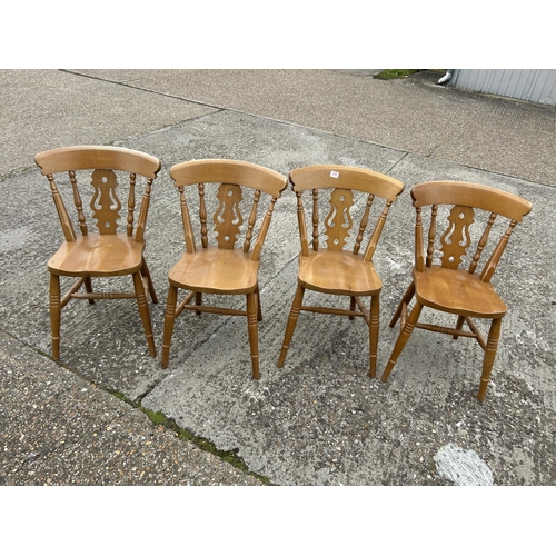 206 - A set of four farmhouse style pine chairs