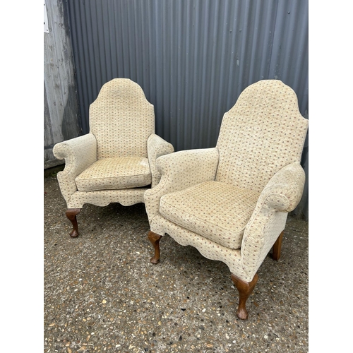 213 - A pair of gold pattern armchairs