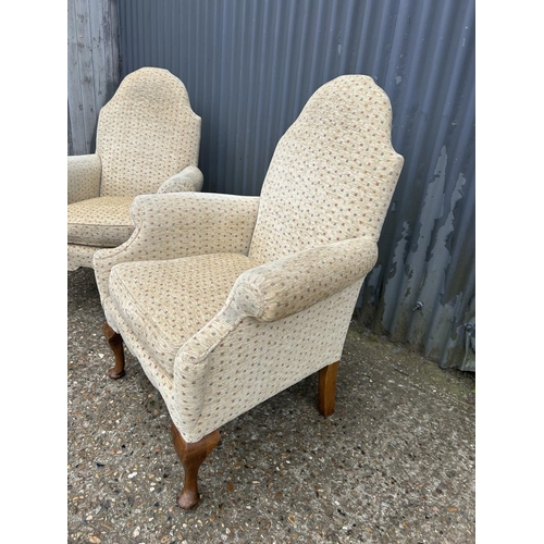 213 - A pair of gold pattern armchairs