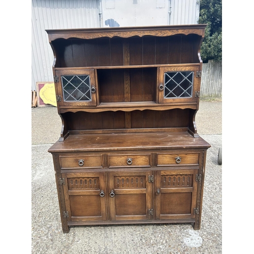 217 - A leaded oak dresser 137x44x180