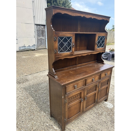 217 - A leaded oak dresser 137x44x180