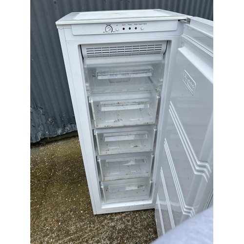 22 - An upright larder freezer