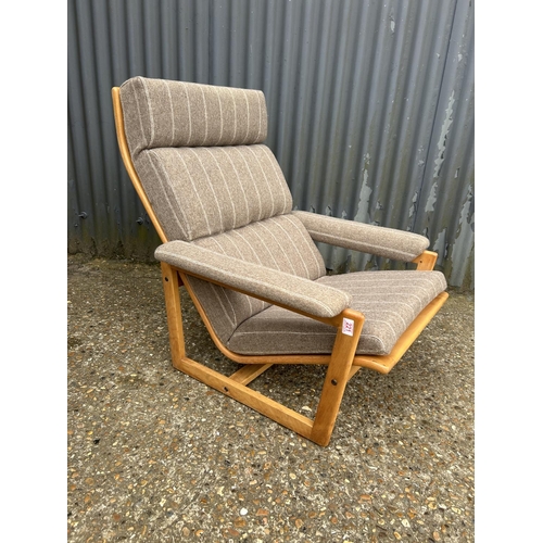 221 - A mid centuey teak framed lounge chair with brown stripe upholstery