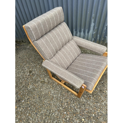 221 - A mid centuey teak framed lounge chair with brown stripe upholstery