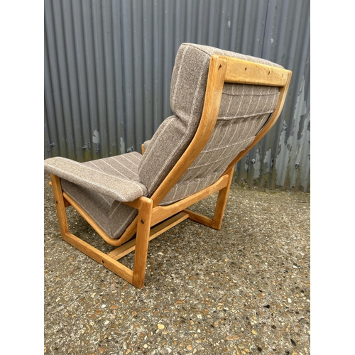 221 - A mid centuey teak framed lounge chair with brown stripe upholstery