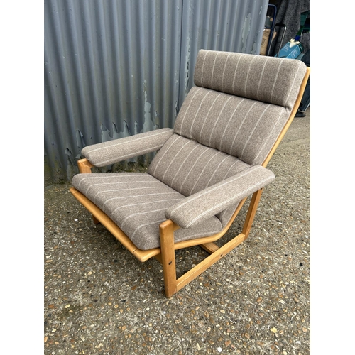 221 - A mid centuey teak framed lounge chair with brown stripe upholstery