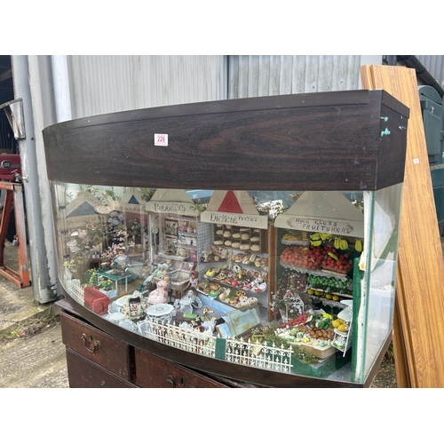 226 - An aquarium tank now converted to house a miniature market scene with dolls and furnishings 122x44x ... 