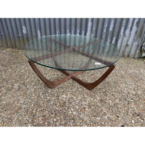 232 - A g plan teak framed spider coffee table 86cm diameter with thick glass top