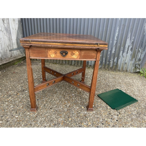 239 - An arts and crafts oak envelope card table with folding top and single drawer, 76x76x77