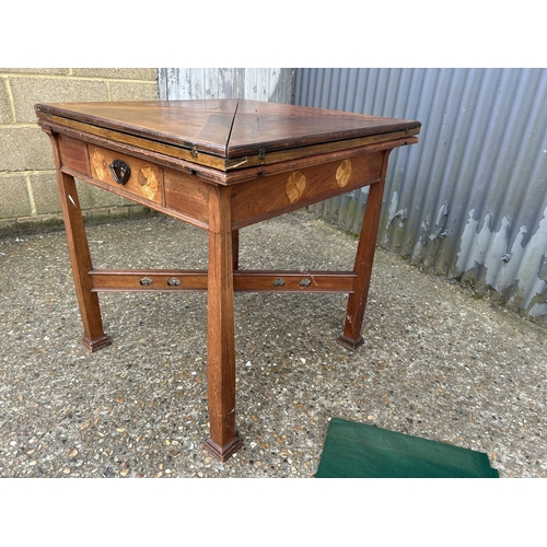 239 - An arts and crafts oak envelope card table with folding top and single drawer, 76x76x77