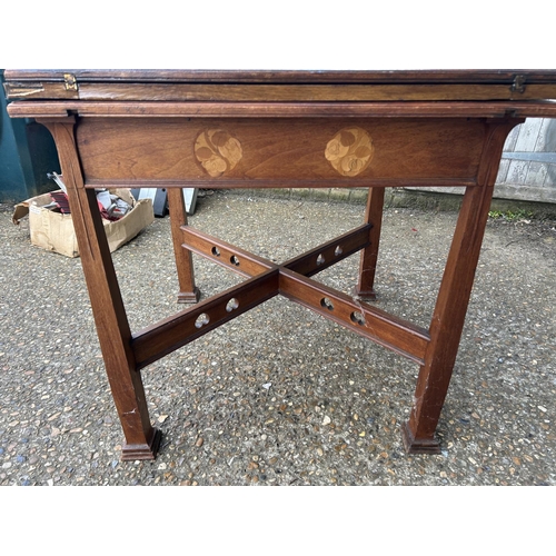 239 - An arts and crafts oak envelope card table with folding top and single drawer, 76x76x77