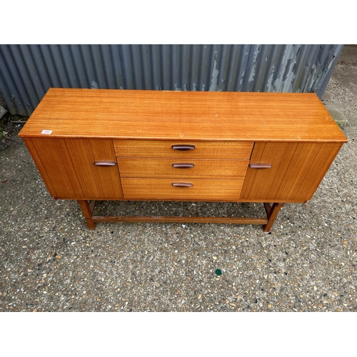 240 - A mid century teak sideboard by SCHRIBER 136x40x74